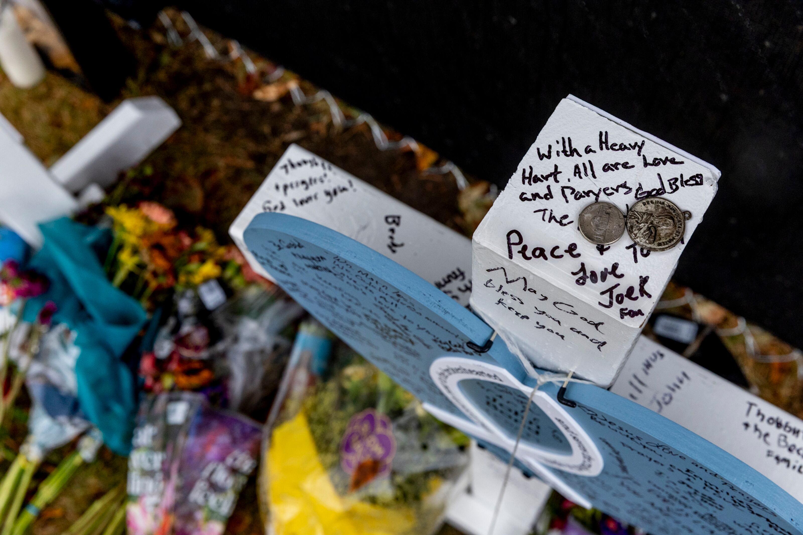 The memorial continues to grow with more flowers and endearing...