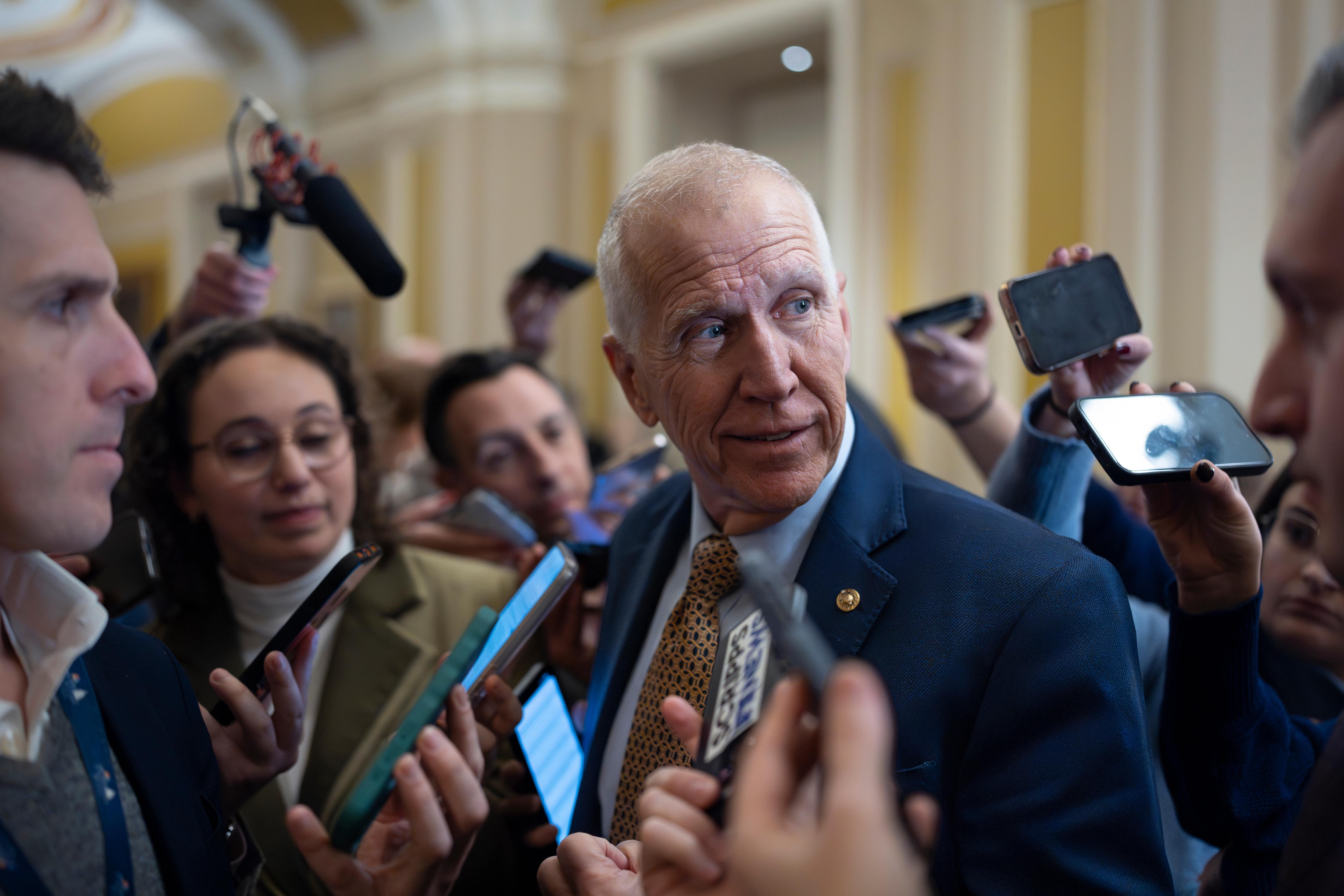 Sen. Thom Tillis, R-N.C., speaks with reporters following a closed-door...